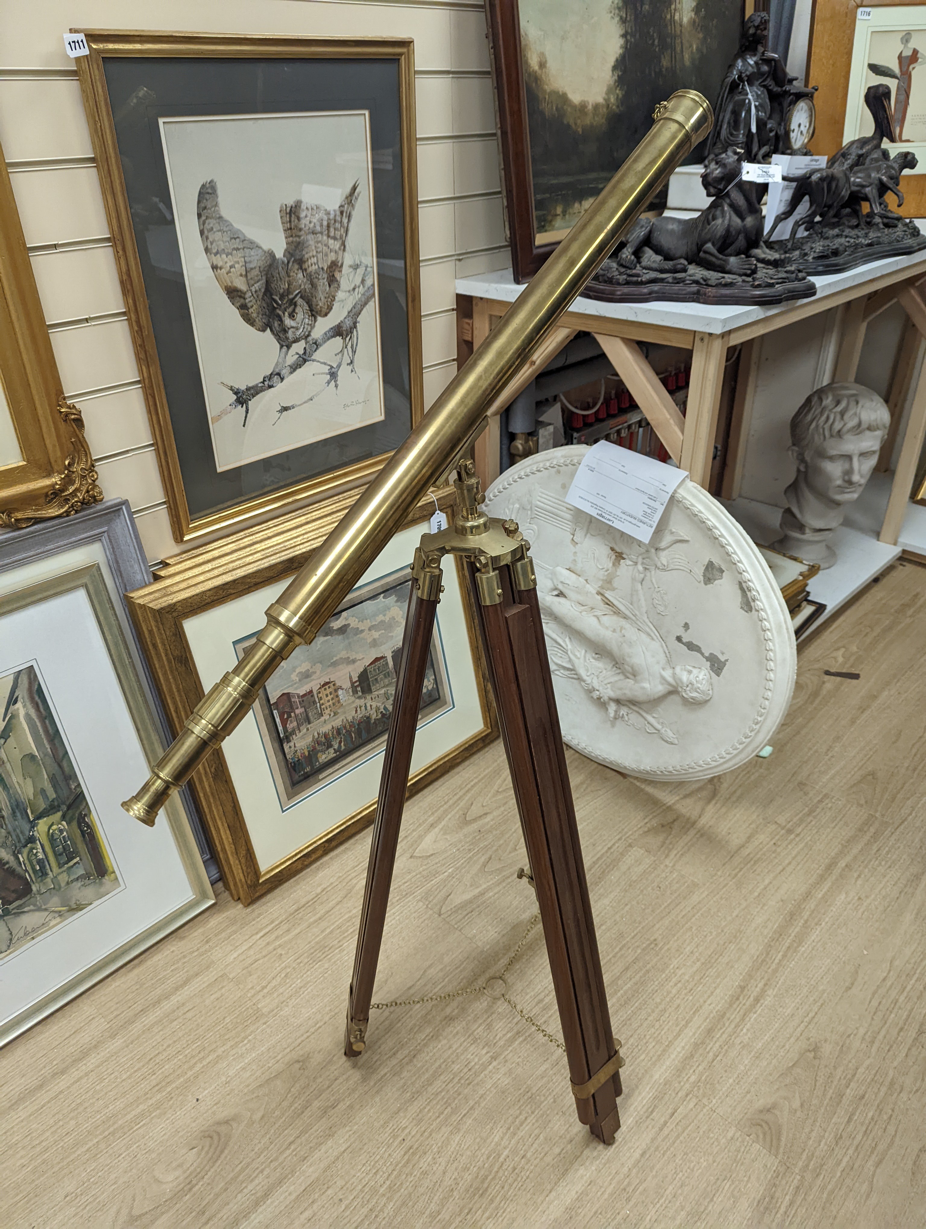 A cased brass telescope and tripod stand